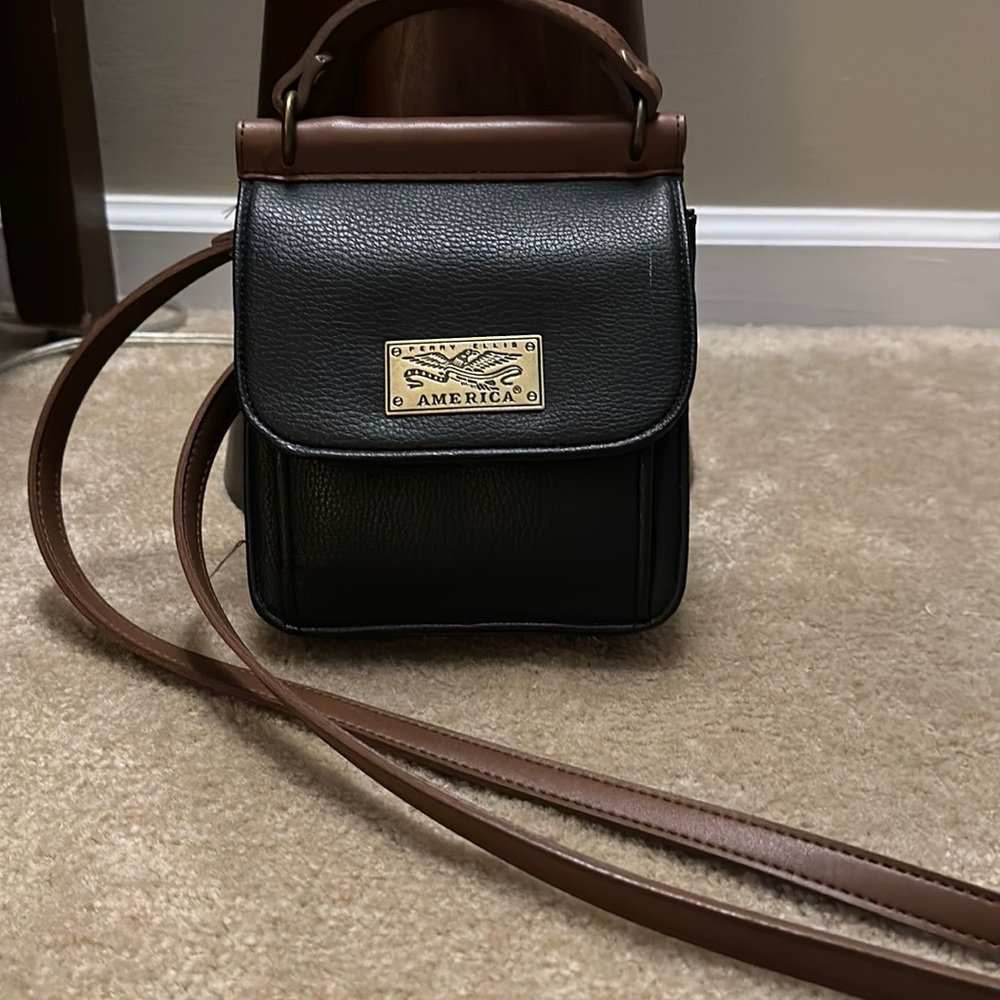 Perry Ellis faux leather cross body bag.